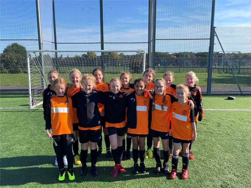 Knebworth girls football team wearing their Intuity-sponsored kit before a league match