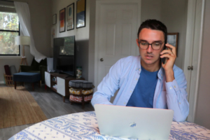 a man working from home remotely using a unified communications solution